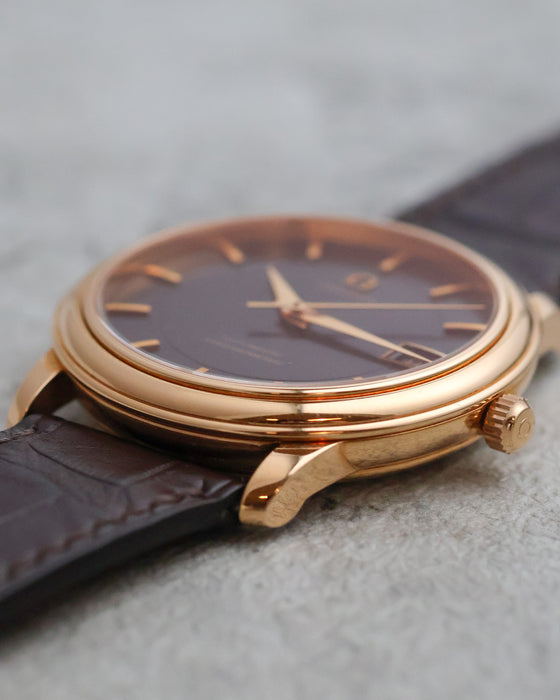 Crown-side profile of the Omega De Ville Prestige with signed Omega crown.