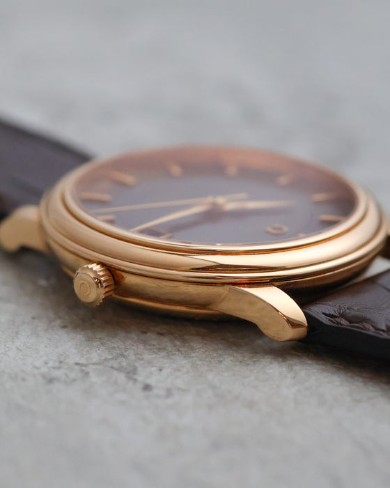 Crown-side profile of the Omega De Ville Prestige with signed Omega crown.