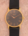 Piaget Tradition Ref. 80035 in 18K rose gold with grey Roman numeral dial and black leather strap.