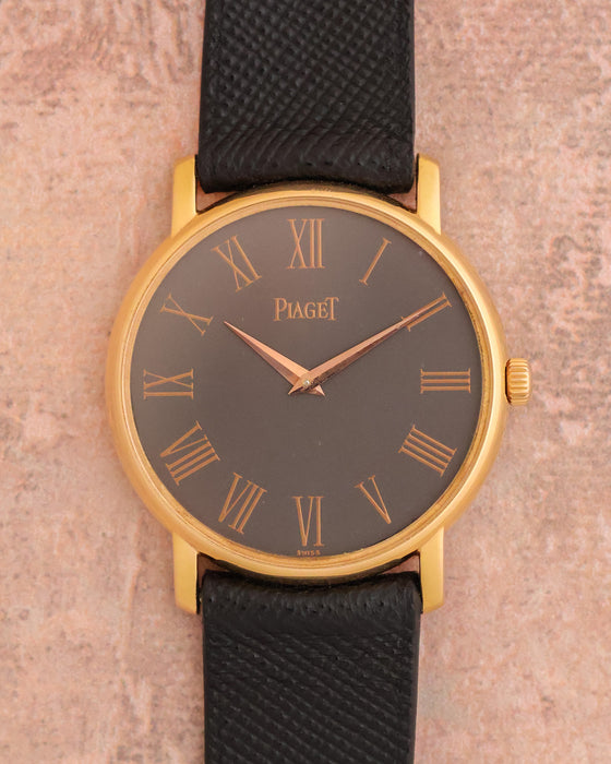 Piaget Tradition Ref. 80035 in 18K rose gold with grey Roman numeral dial and black leather strap.