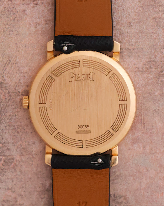 Caseback of the Piaget Tradition Ref. 80035 showing Piaget branding, reference number and gold hallmarks.