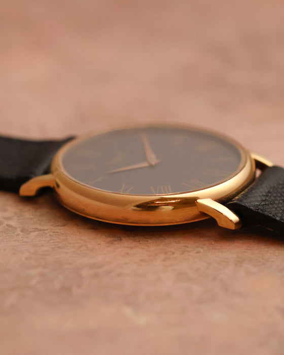 Side profile of the Piaget 80035 highlighting its thin rose-gold case and downturned lugs.