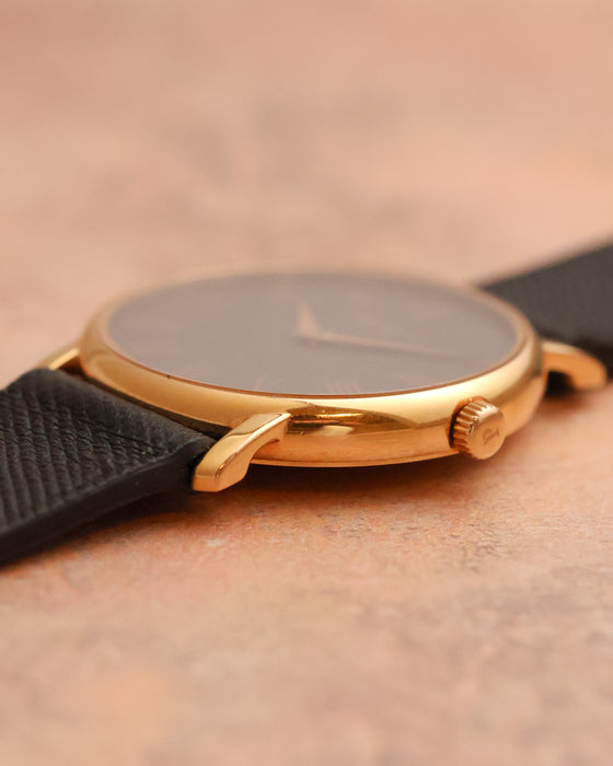 Crown-side profile showing the signed Piaget crown and slim construction of the rose-gold case.