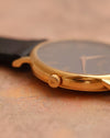 Close-up of the signed Piaget crown and polished 18K rose-gold case.