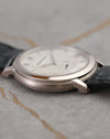 Side profile of the Audemars Piguet Jules Audemars 15056BC showing its polished white-gold bezel, brushed caseband and black leather strap.