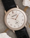 Angled dial view highlighting the engine-turned centre, applied Roman numerals and subsidiary seconds.