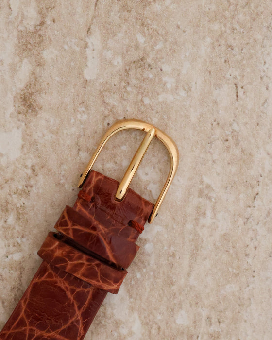 Original Audemars Piguet 18K yellow-gold pin buckle fitted to the brown leather strap.