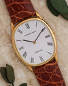 Angled front view of Audemars Piguet Ref. 4083 showing its elliptical yellow-gold case and white dial.