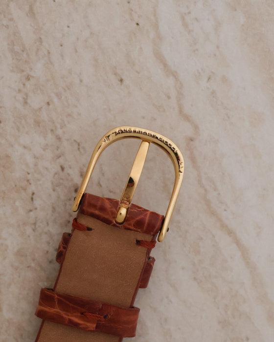 Reverse view of the signed Audemars Piguet yellow-gold buckle and leather strap.