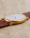 Low-angle view highlighting the polished and brushed finishing of the yellow-gold case and lugs.