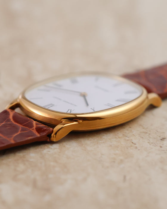 Low-angle view highlighting the polished and brushed finishing of the yellow-gold case and lugs.