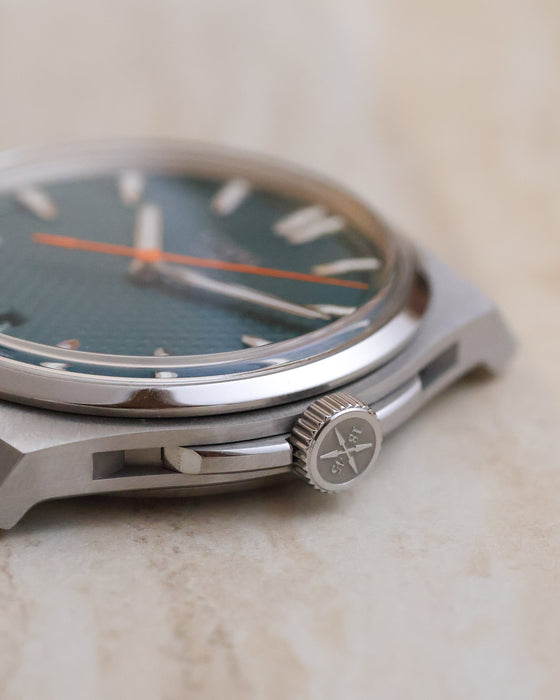 Side profile of the Czapek Antarctique showing its polished bezel, brushed steel case and signed crown.