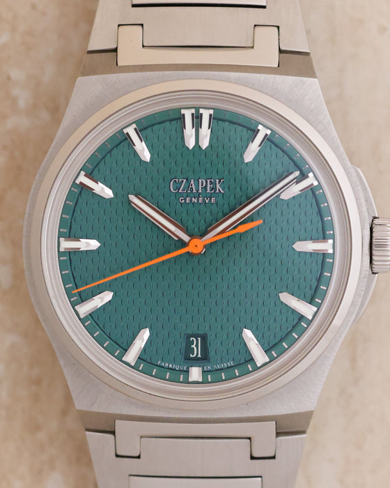 Front view of the Czapek Antarctique Fratello Edition showing its Viridian Green textured dial and orange seconds hand.