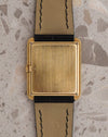Caseback of the vintage Audemars Piguet rectangular manual-winding watch in yellow gold on a black leather strap.