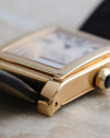 Close-up of the Tank à Vis case construction, exposed bezel screw and brushed yellow-gold case flank.