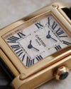 Macro photograph of the Dual Time guilloché dial with Roman numerals and blued-steel hands.