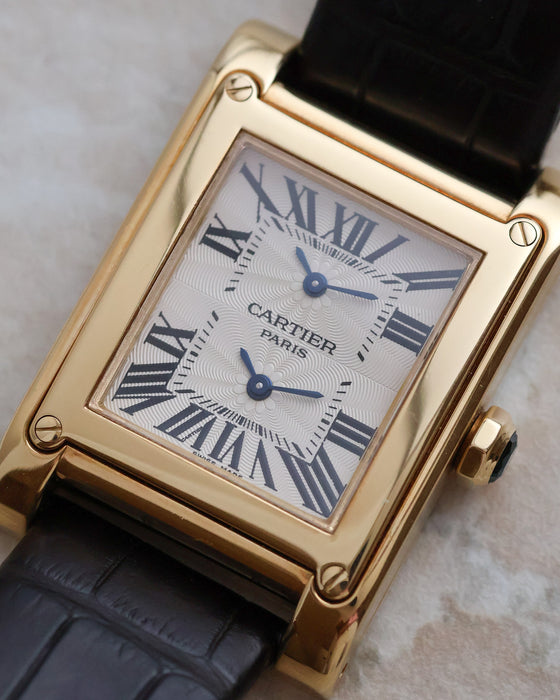 Angled view of the Cartier Tank à Vis Dual Time ref. 2551 in 18K yellow gold.