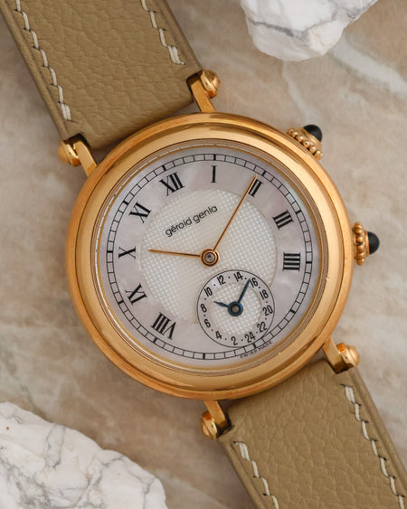 Angled view of Gérald Genta G3257.7 showing its mother-of-pearl Roman numeral dial and dual-time display.