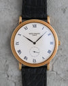 Front view of the Patek Philippe Calatrava 3919J showing its white Roman numeral dial and Clous de Paris bezel.