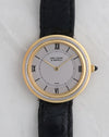 Van Cleef & Arpels Disco Volante G1525 in 18K yellow and white gold with silver dial and black leather strap.