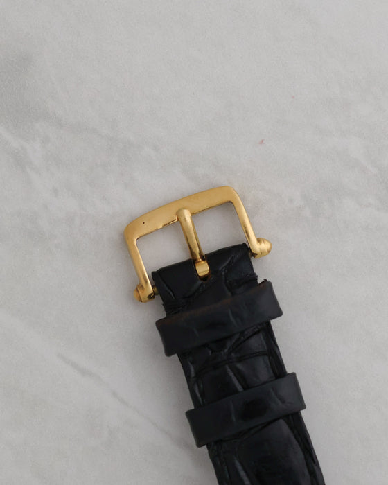 Original 18K yellow gold Van Cleef & Arpels pin buckle fitted to the black leather strap.