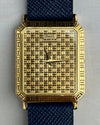 Close-up of Piaget 7143 dial showing geometric gold grid pattern and Art Deco influence