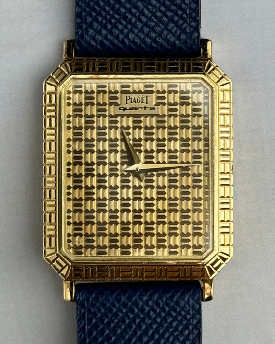 Close-up of Piaget 7143 dial showing geometric gold grid pattern and Art Deco influence