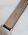 Underside of the original Cartier leather strap with Cartier signature and caseback partially visible.