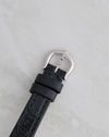 Reverse view of the original Cartier pin buckle attached to the black leather strap.