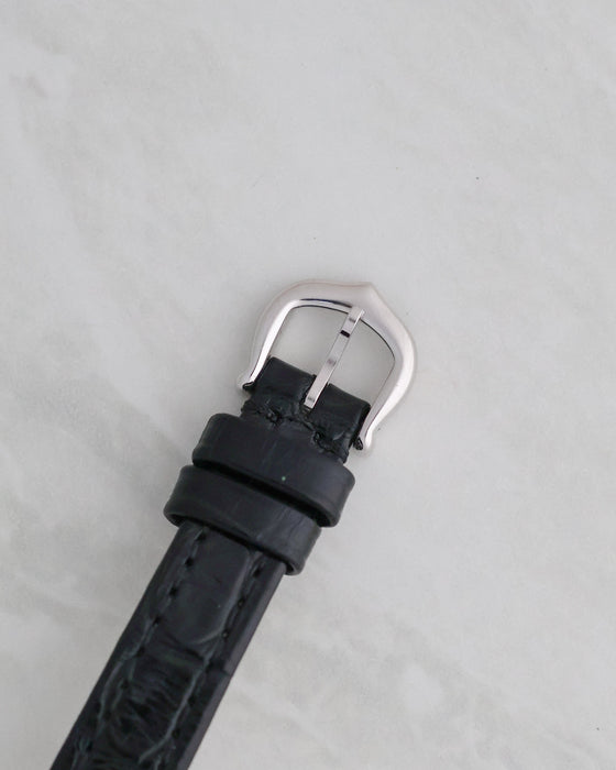 Reverse view of the original Cartier pin buckle attached to the black leather strap.