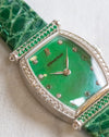Detailed view of the green mother-of-pearl dial with diamond and green gemstone hour markers, AP signature and leaf-shaped hands.