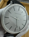 Detailed view of vintage AP 4029 hobnail-pattern dial with applied indices and silver-toned finish