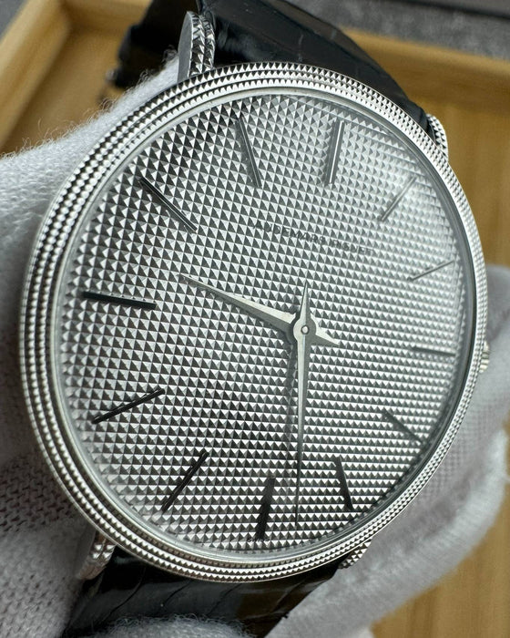 Detailed view of vintage AP 4029 hobnail-pattern dial with applied indices and silver-toned finish