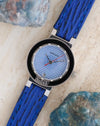 Angled view of the Gérald Genta Retro Classic with its faceted crystal, red seconds hand and numbered bezel plaque.