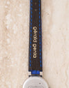 Reverse view of the original blue leather strap showing the gold Gérald Genta signature.