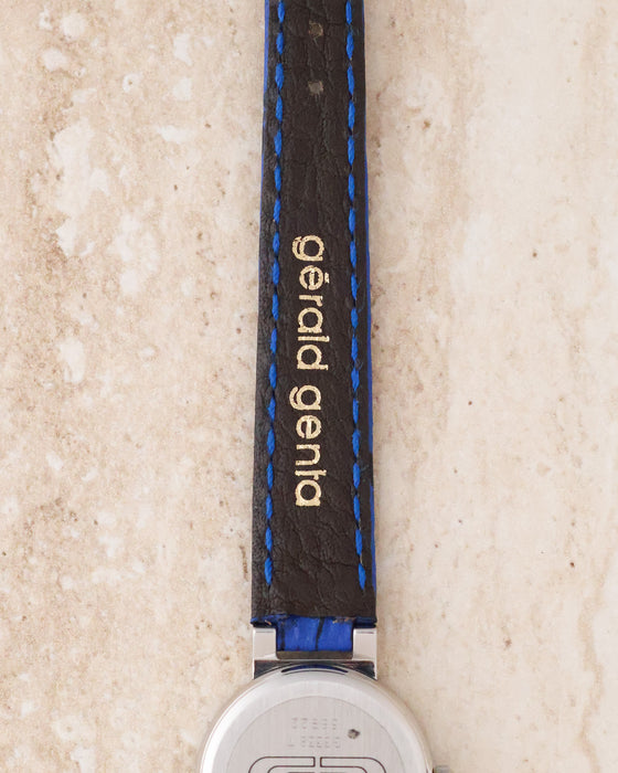 Reverse view of the original blue leather strap showing the gold Gérald Genta signature.
