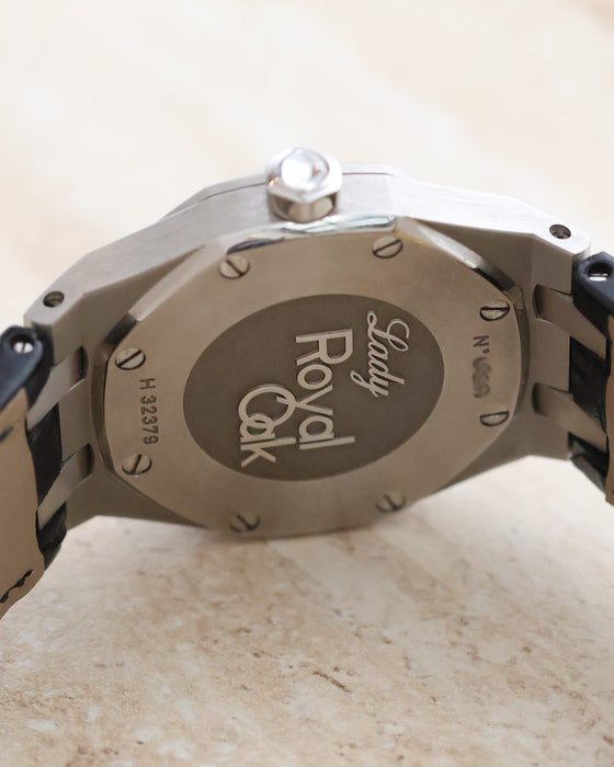 Stainless steel caseback of the Audemars Piguet Royal Oak Lady featuring the engraved Lady Royal Oak emblem and serial markings.