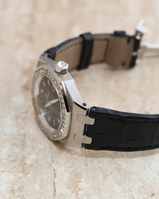 Side profile of the Royal Oak Lady showing its brushed steel case, diamond-set bezel and angular strap attachments.