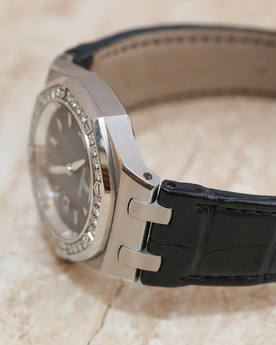 Close-up of the Royal Oak Lady case flank, diamond bezel and integrated-style leather strap attachment.