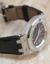 Three-quarter side view showing the Royal Oak Lady diamond bezel, sculpted lugs and black leather strap.