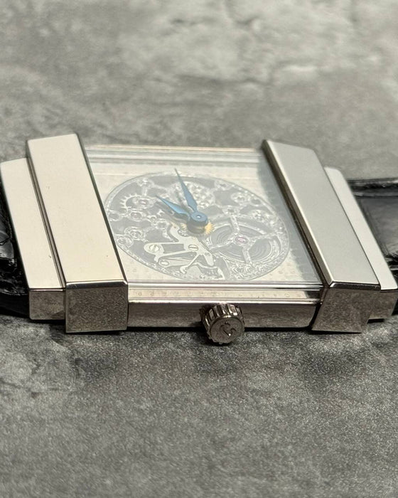 Side profile of Concord Crystal Skeleton watch with 18K white gold top hat case and skeleton architecture