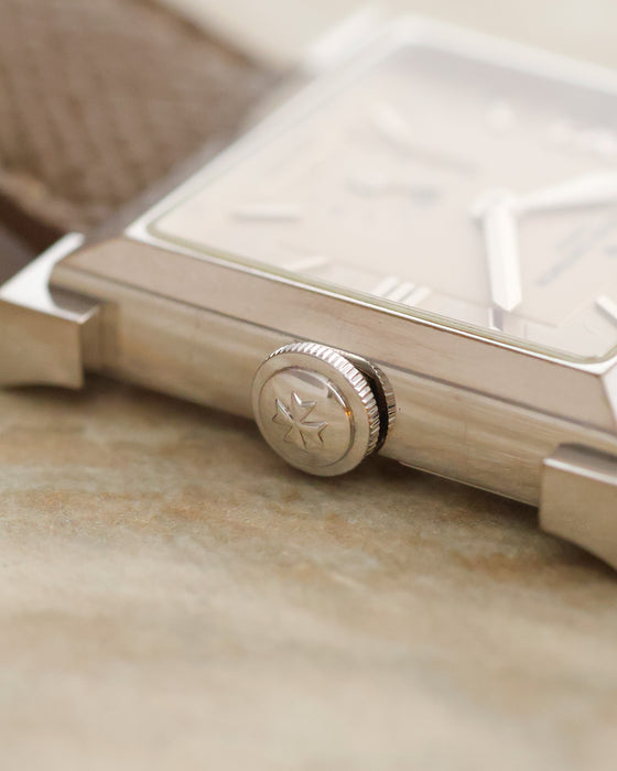 Macro photograph of the Vacheron Constantin signed crown with its engraved Maltese Cross emblem.