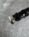 Close-up of original Concord 18K white gold buckle paired with factory alligator strap