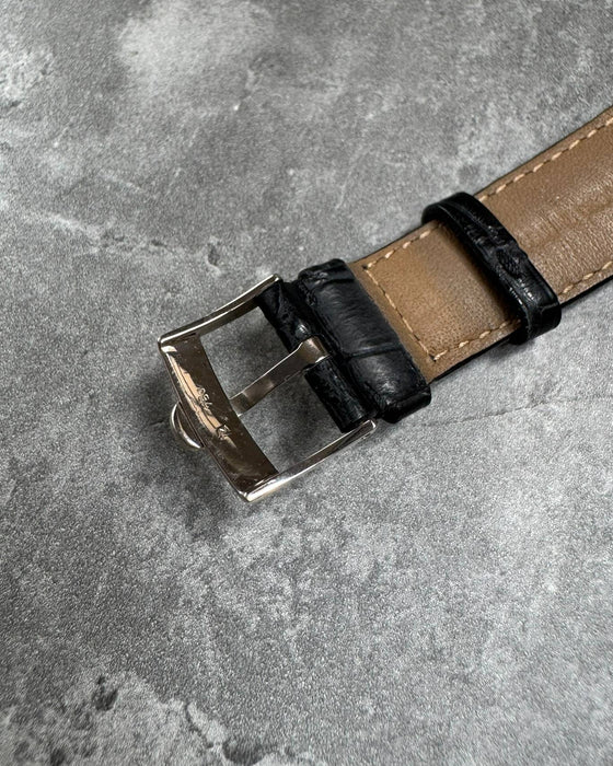 Signed Concord white gold buckle on black alligator leather strap, part of limited edition timepiece