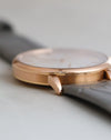Close-up of the Saxonia's 18K rose gold caseband, polished bezel and angular lugs.