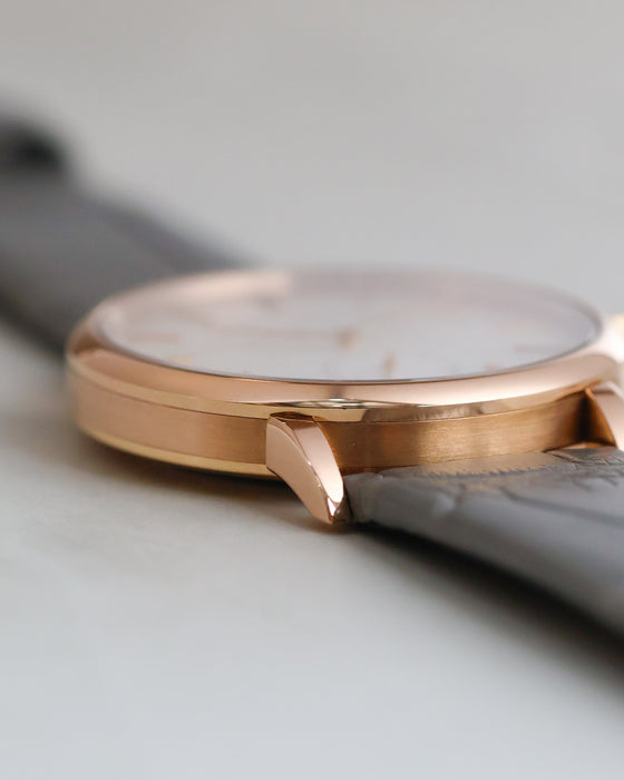 Close-up of the Saxonia's 18K rose gold caseband, polished bezel and angular lugs.