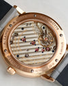 Detailed view through the sapphire caseback showing the Glashütte three-quarter plate, gold chatons and hand-engraved balance cock.