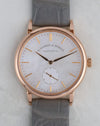 Straight-on dial photograph of the Saxonia 219.043 with its white mother-of-pearl dial and slim rose gold hands.