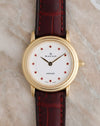 Front view of the Blancpain Lady Villeret Ref. 0096 featuring a white dial with twelve pink gemstone hour markers and an 18K yellow gold case.