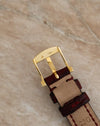 Close-up of the original Blancpain 18K yellow gold pin buckle showing the 750 hallmark and maker's mark.
